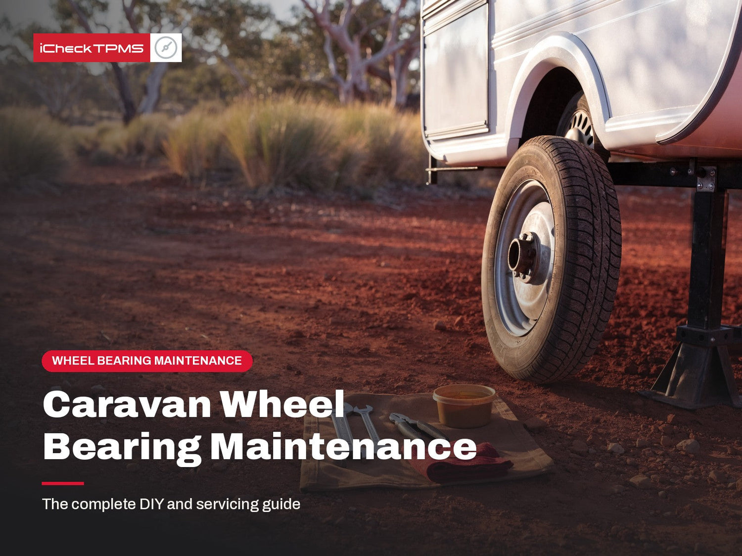 Caravan wheel bearing maintenance guide: single-axle caravan raised on a stand with wheel removed at an Australian outback campsite